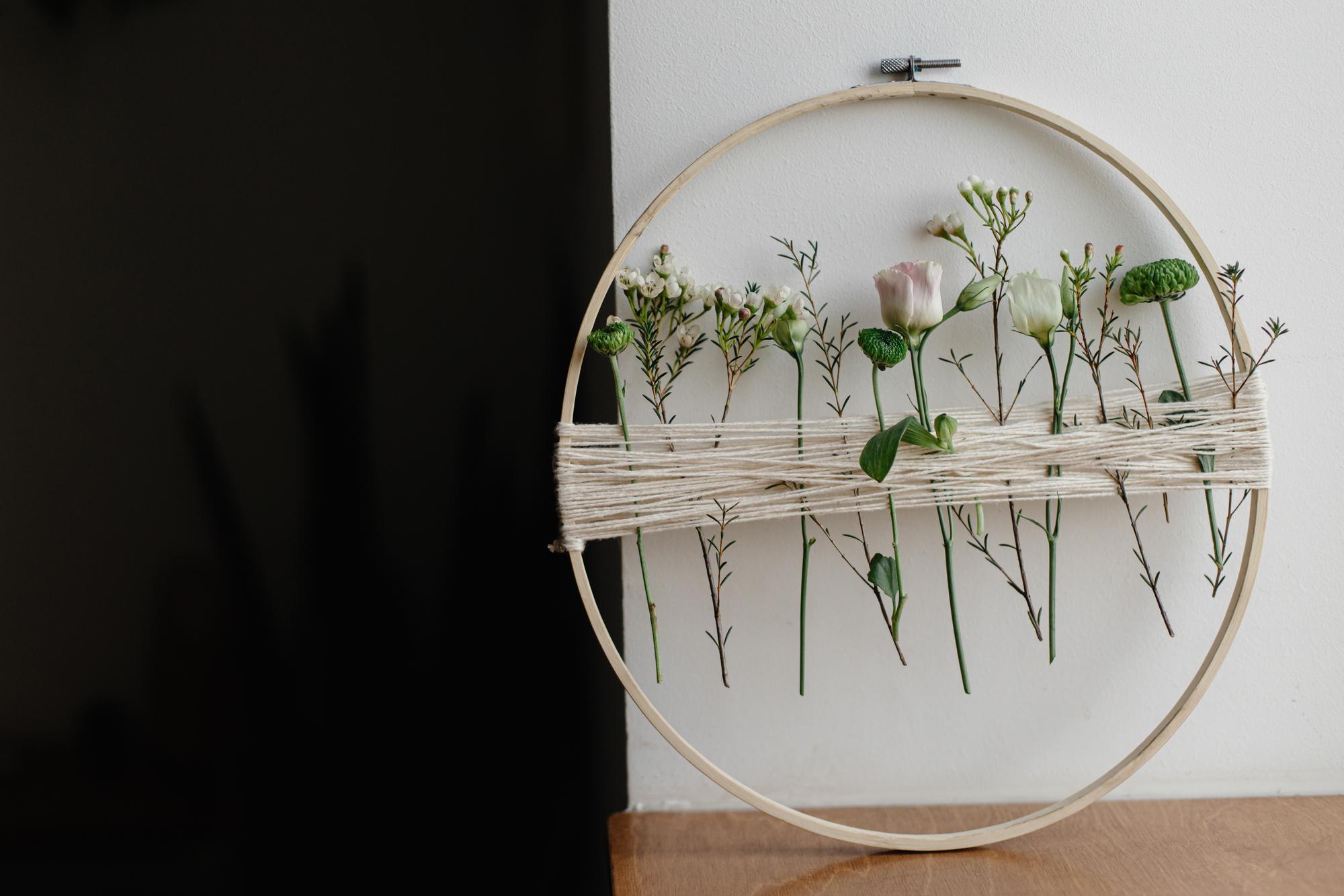 framed embroidered wall piece in gallery setting